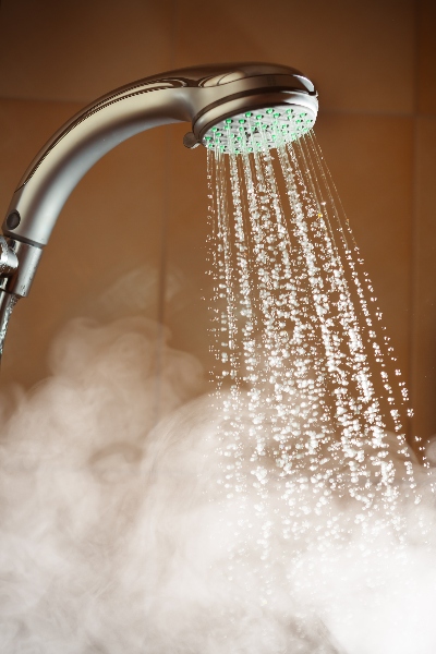 Handheld Showerhead Spraying Hot Steamy Water