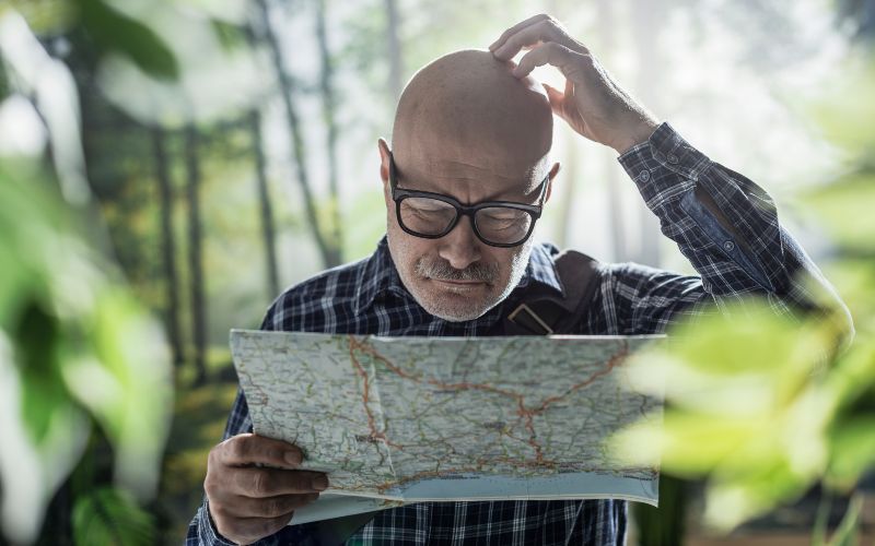 Confused Man Reading A Map