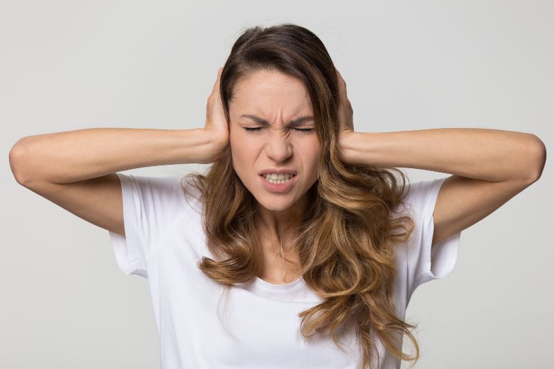 Woman Covering Ears Woman Covering Ears