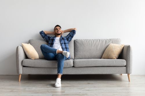 Man sitting on a sofa Man sitting on a sofa