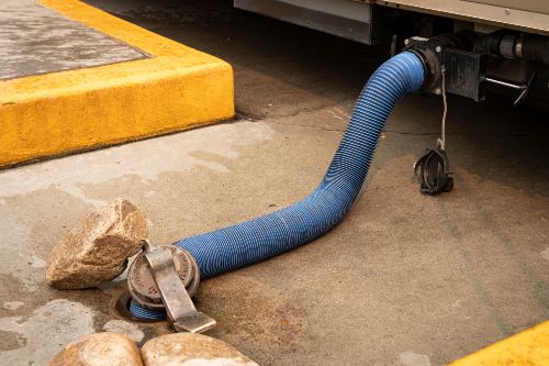RV Sewer Hose Connected To Sewer