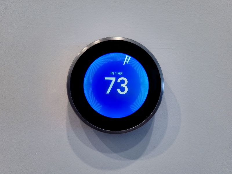 A smart thermostat set to 73 degrees